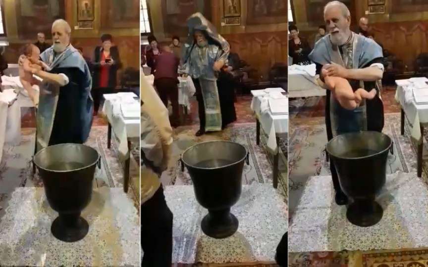 (VIDEO) Botez de groază! Un preot nervos a început a zdruncina bebeluşul care plângea speriat